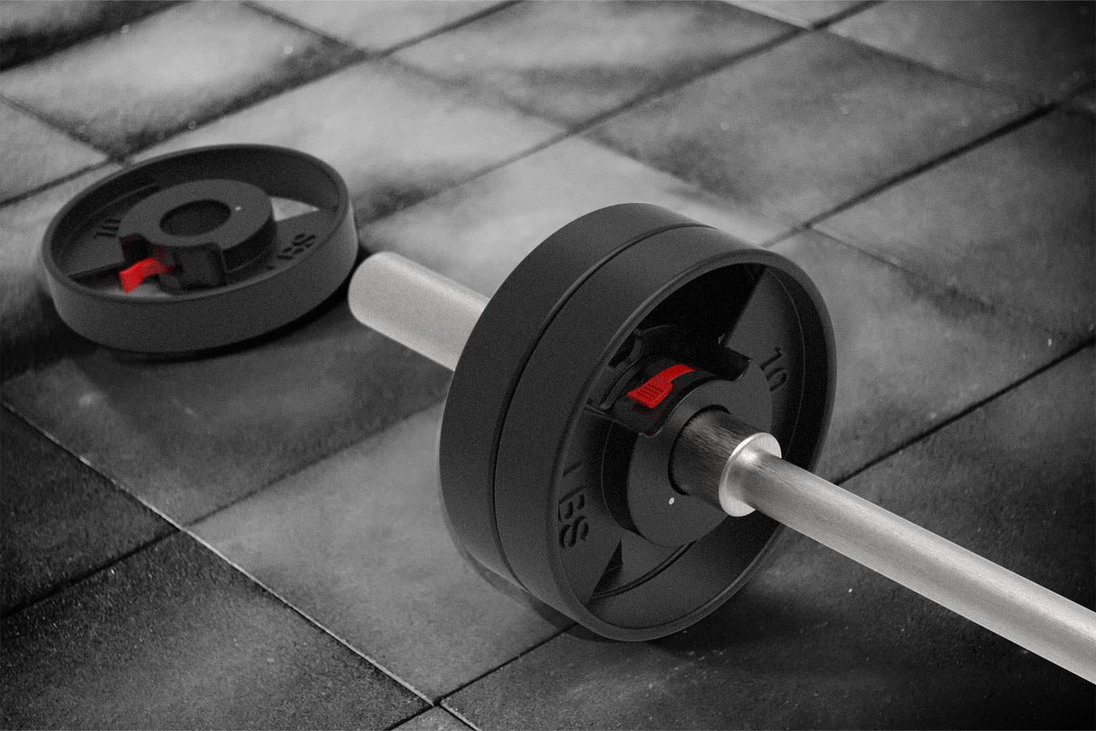 The Ultimate Weight Plate on barbell